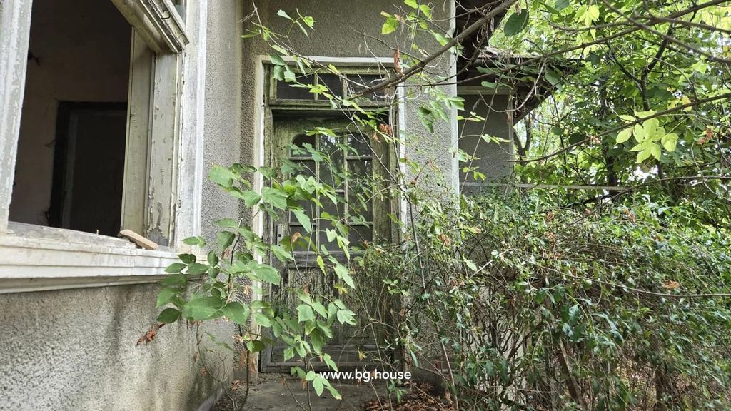 Property photo 3 of 37 Close-Up Of An Old Wooden Door And Window With Dense Plants Growing Around