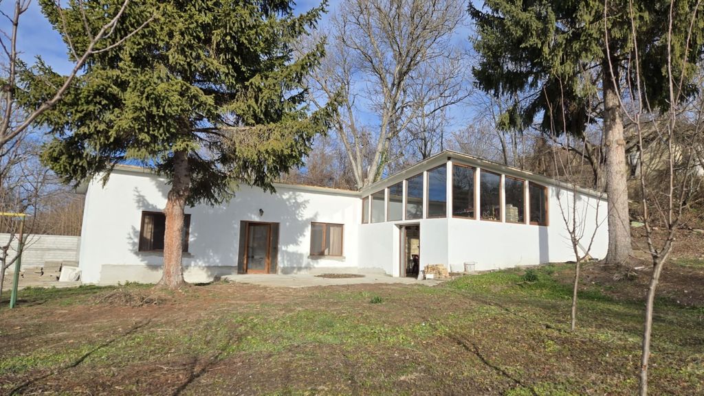 Property photo 1 of 50 Exterior View Of The Renovated Bulgarian House Showing White Walls, Large Windows, And Surrounding Trees