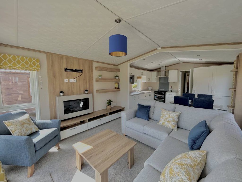 Property photo 2 of 8 Open Plan Lounge With Modern Fireplace And Tv Storage Unit