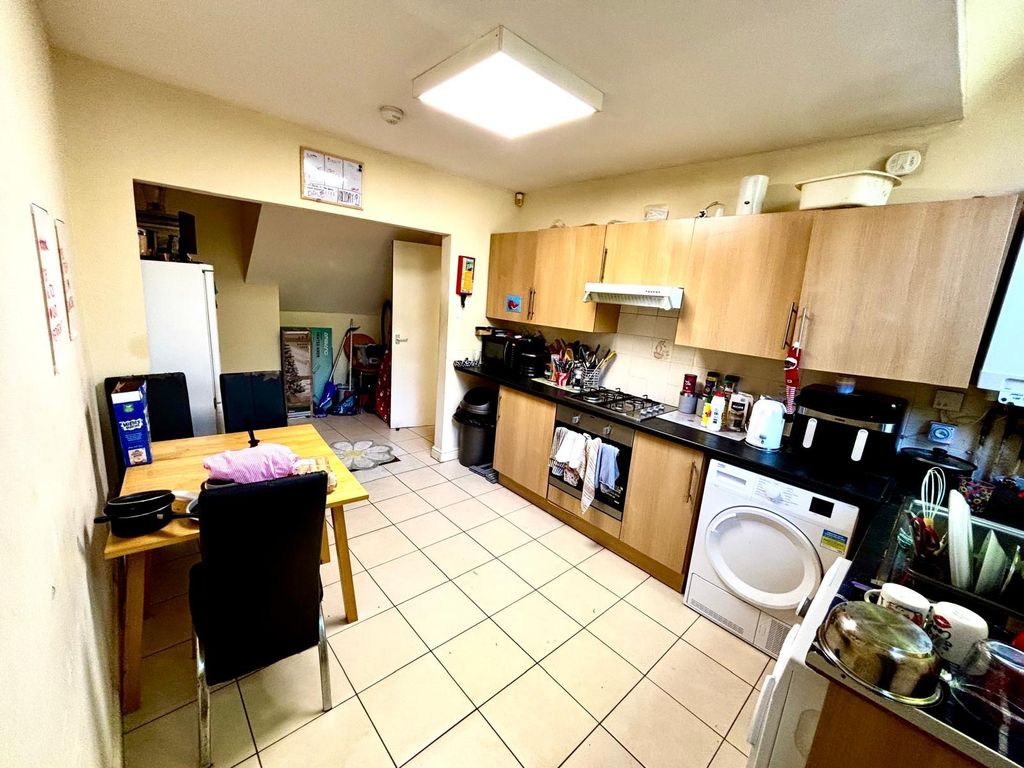 Property photo 3 of 6 A Practical And Well-Used Kitchen Featuring Wooden...