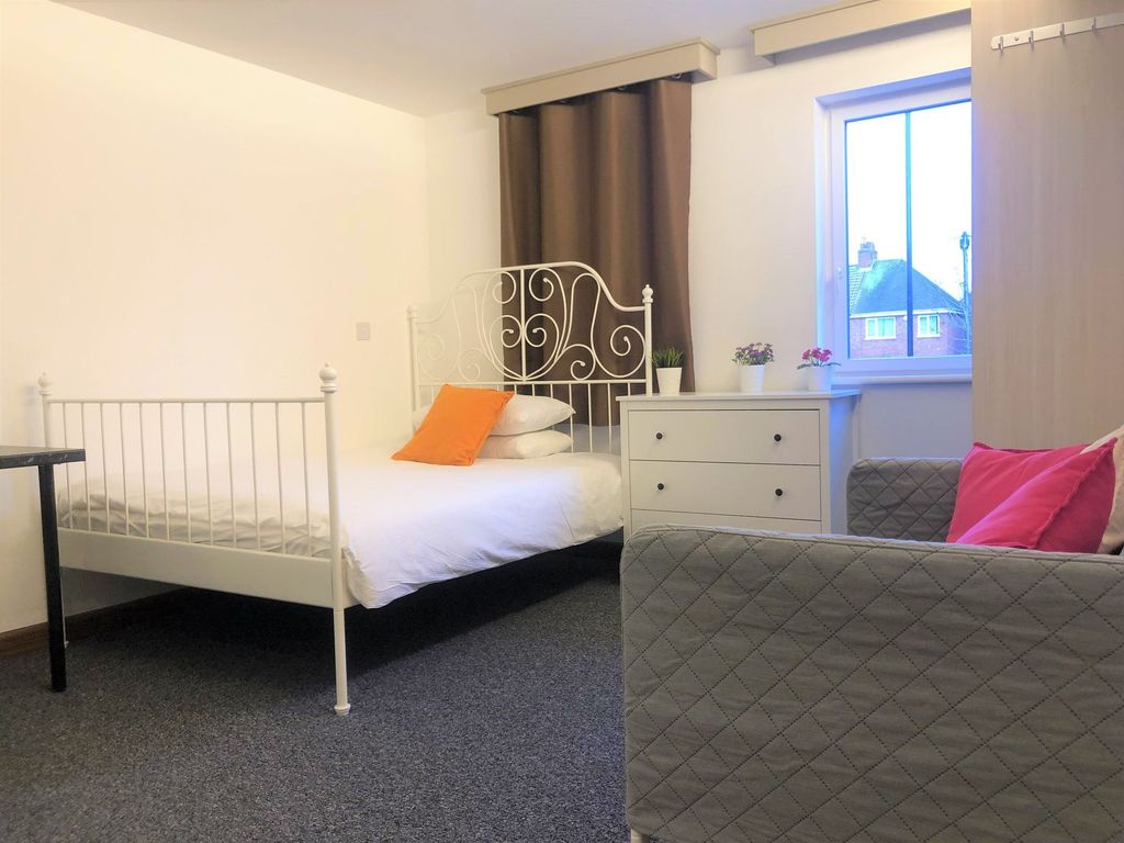 Property photo 1 of 5 Bright And Tidy Bedroom Featuring A White Metal Be...
