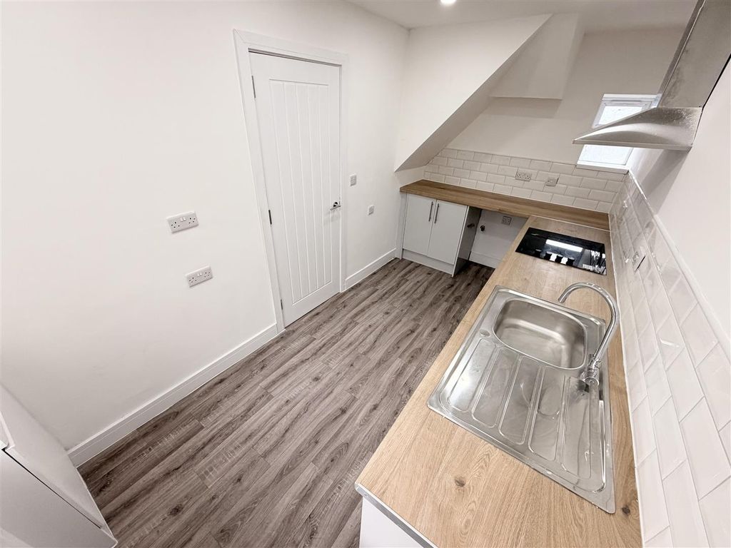 Property photo 2 of 13 Modern Kitchen With Sleek Wood-Effect Worktops...