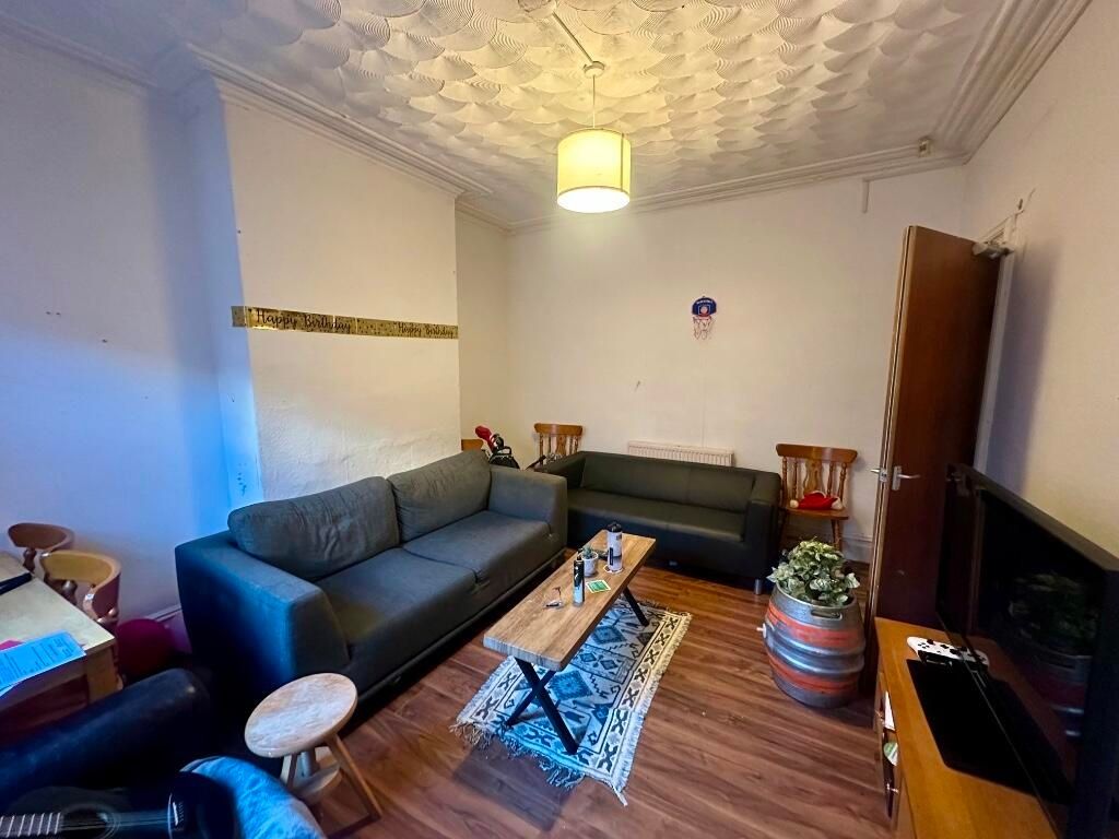 Property photo 1 of 14 A Cozy Living Room Featuring Two Comfortable Sofas...