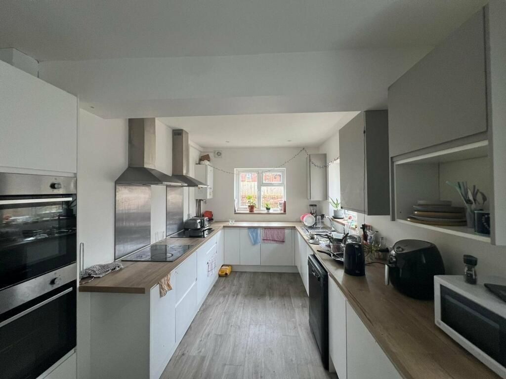 Property photo 1 of 15 Bright And Modern Kitchen Featuring Ample Countert...