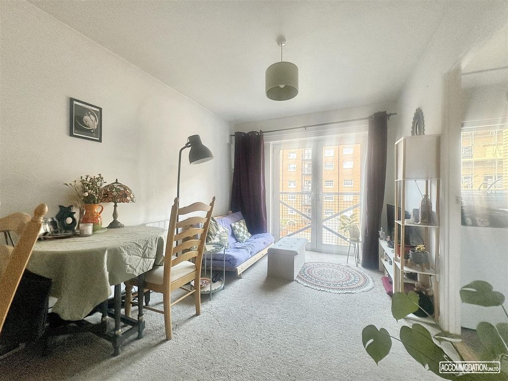 Property photo 2 of 8 Bright Lounge With Dining Area And Balcony Access...