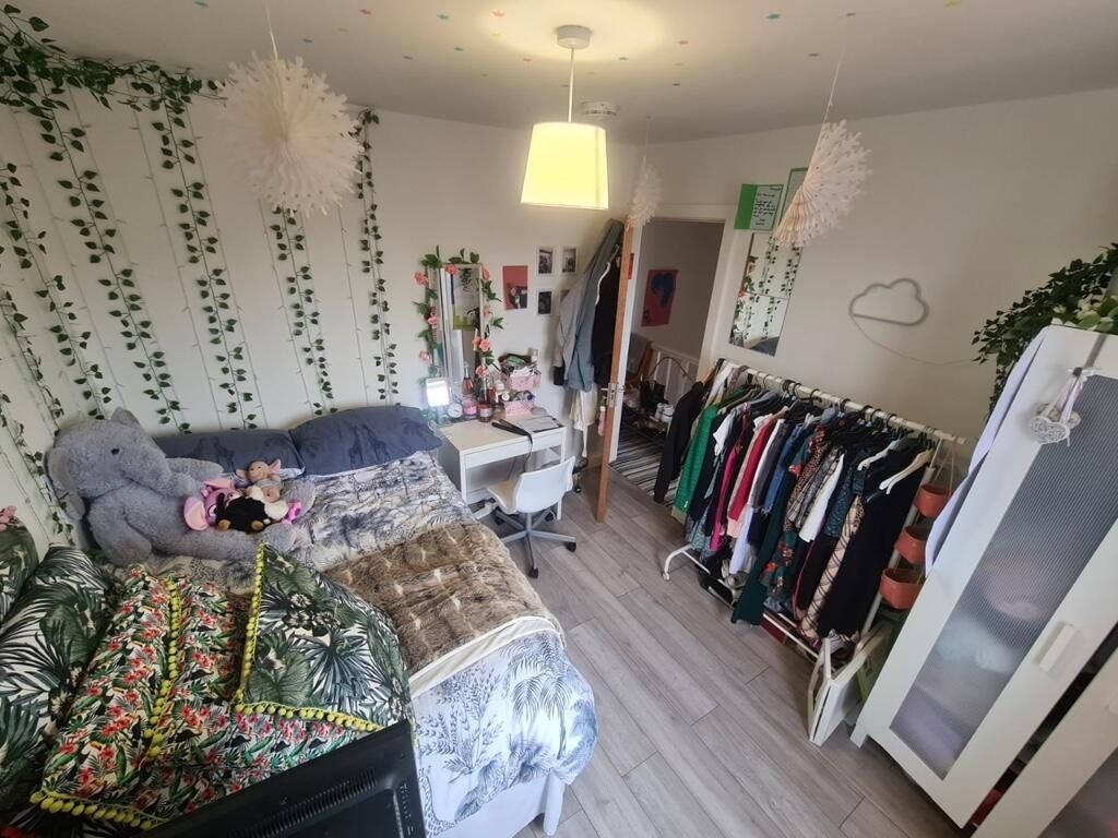 Property photo 2 of 15 A Cozy And Well-Decorated Master Bedroom Featuring...