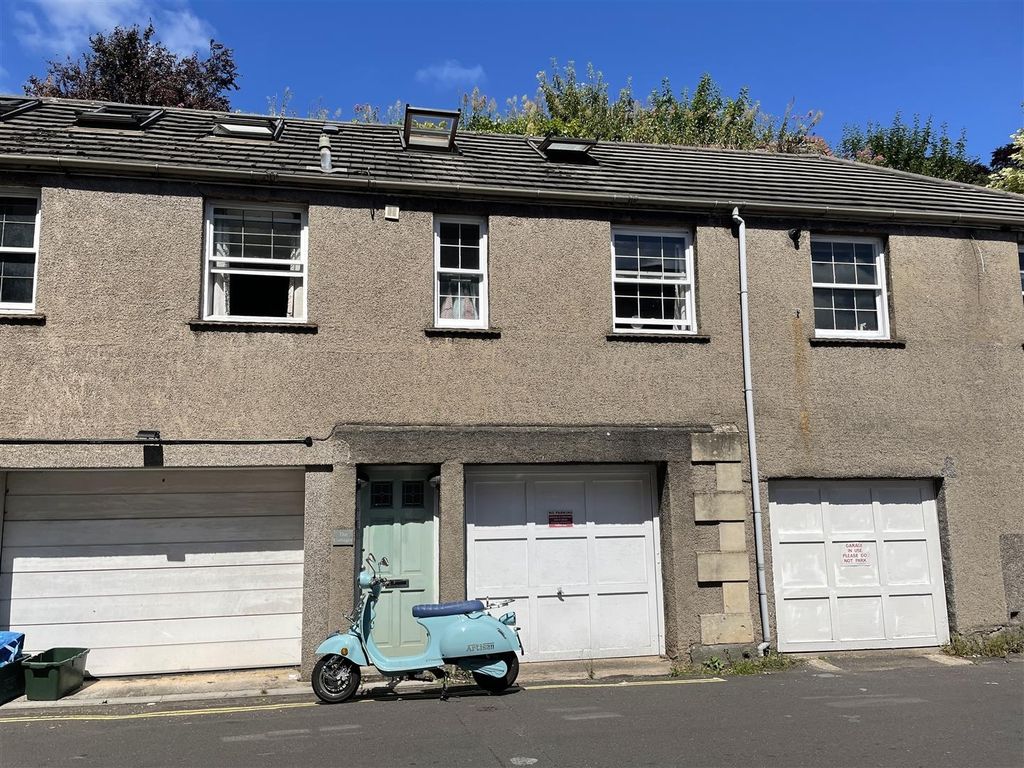 Property photo 1 of 10 Row Of Garages With Vintage Scooter And Clear Sky...