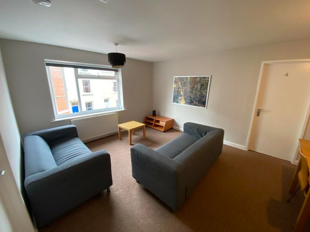 Property photo 1 of 14 Bright And Inviting Living Room Featuring Comforta...