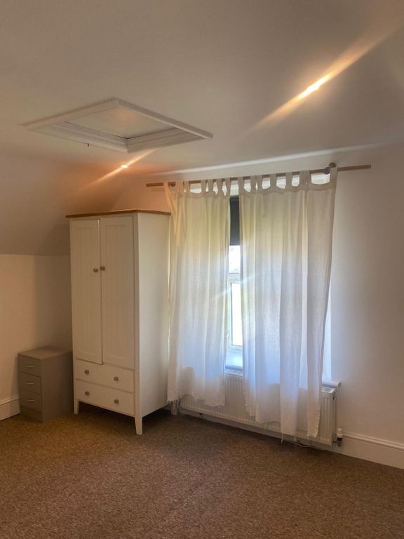 Property photo 2 of 6 A Cozy Bedroom With A Window Allowing Natural Ligh...