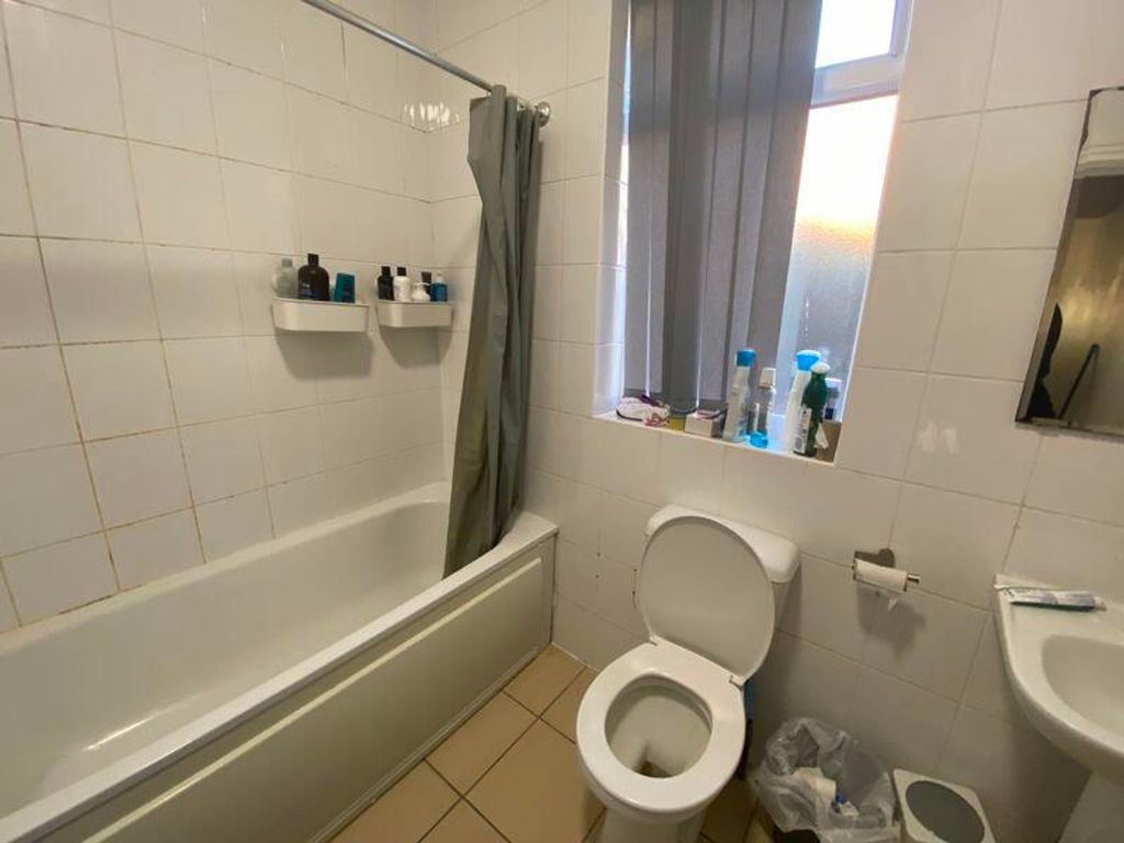 Property photo 2 of 10 A Well-Lit Bathroom Featuring A Bath And Modern fi...