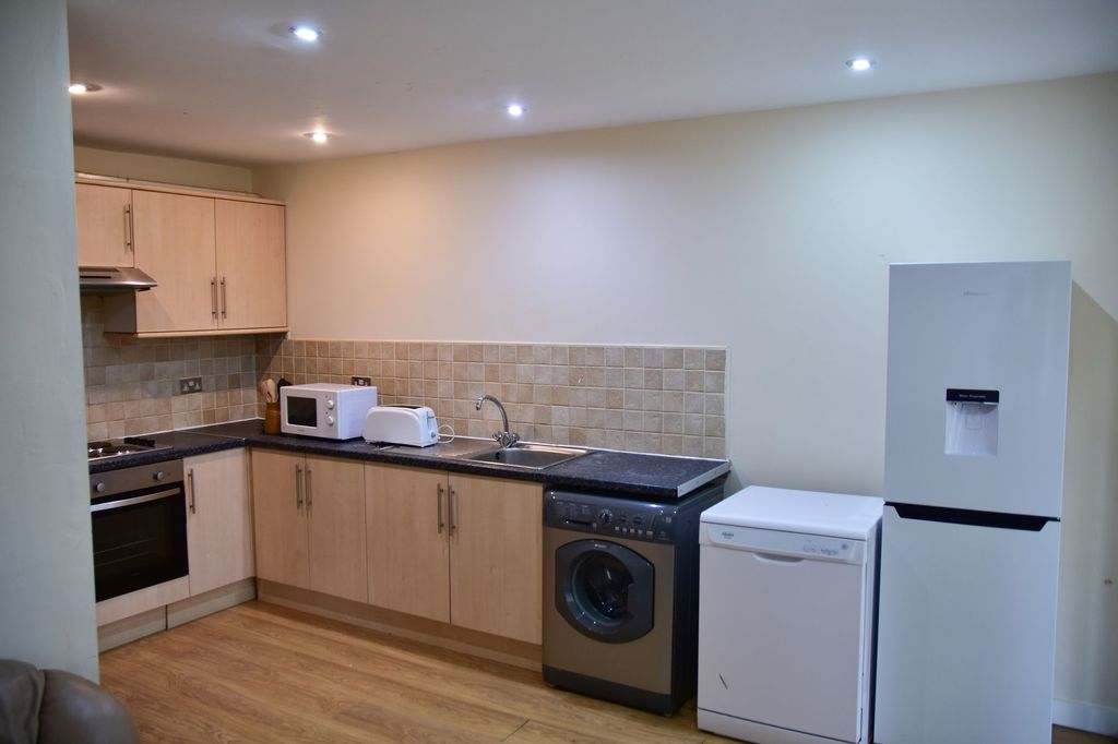 Property photo 1 of 7 A Modern, Neatly Maintained Kitchen Featuring Wood...