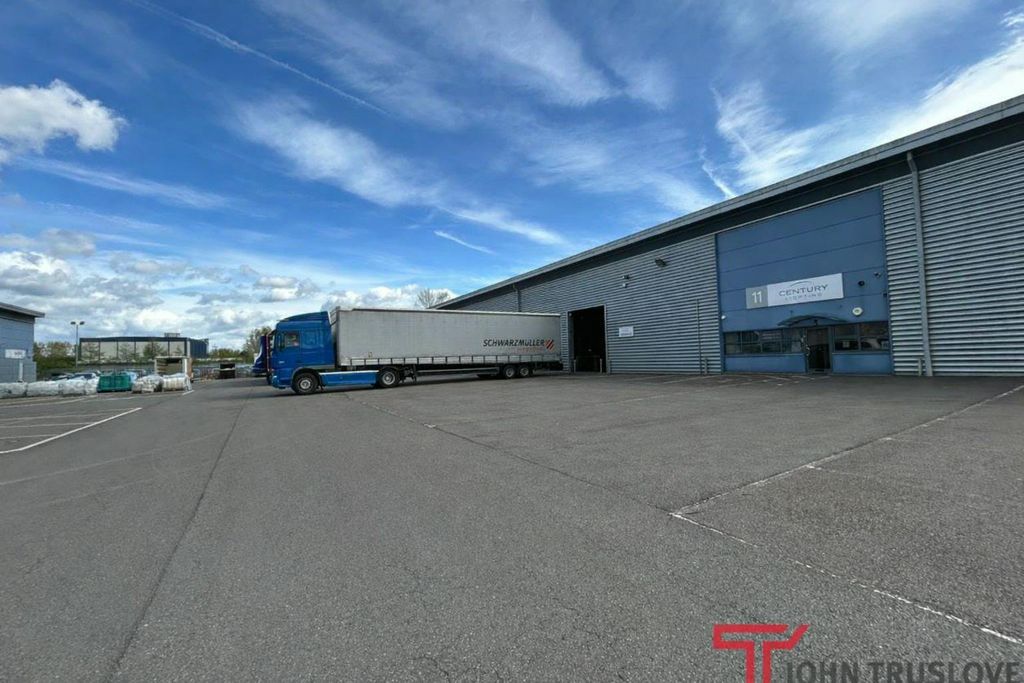 Property photo 1 of 9 Industrial Warehouse With Parked Truck.Png