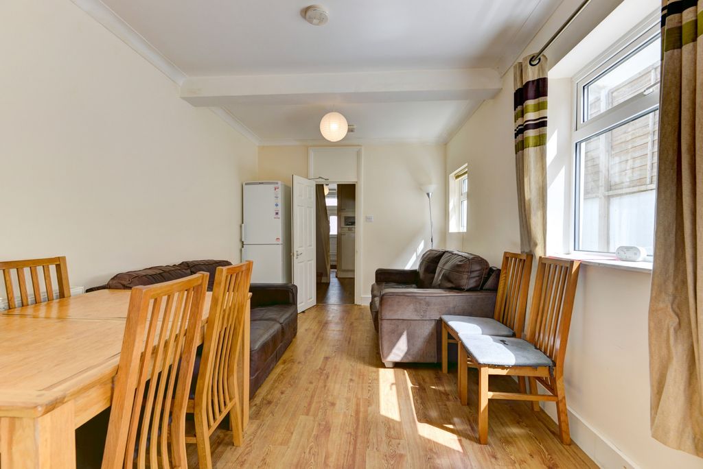 Property photo 1 of 20 A Bright And Inviting Living Room Featuring Large ...