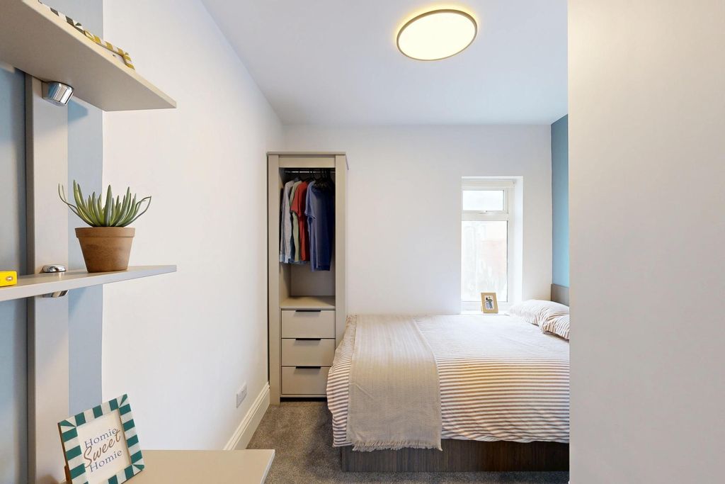 Property photo 1 of 10 Bright And Inviting Master Bedroom Featuring A Coz...