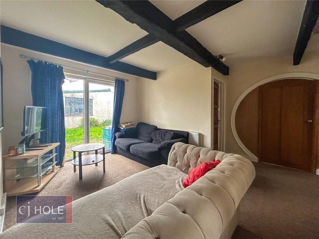 Property photo 2 of 15 A Cozy Living Room Featuring Comfortable Seating, ...