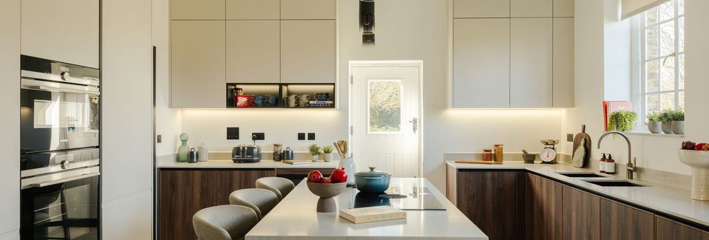 Property photo 1 of 4 Central Kitchen / Breakfast Island, Brown Cabinets, White Walls, Ample Counter Space, Built-In
