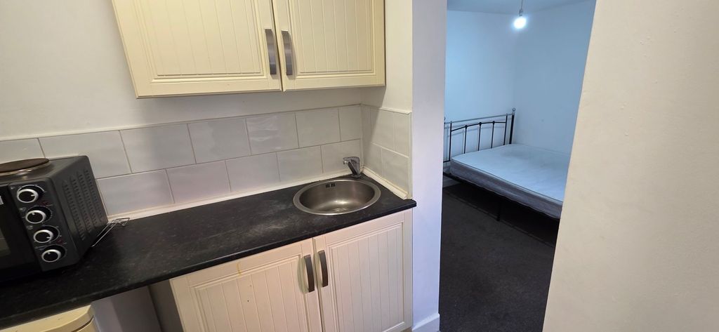 Property photo 1 of 10 Compact Kitchenette With Sink And Adjoining Bed...