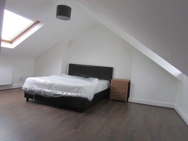 Property photo 1 of 10 Bright And Spacious Attic Bedroom Featuring A Comf...