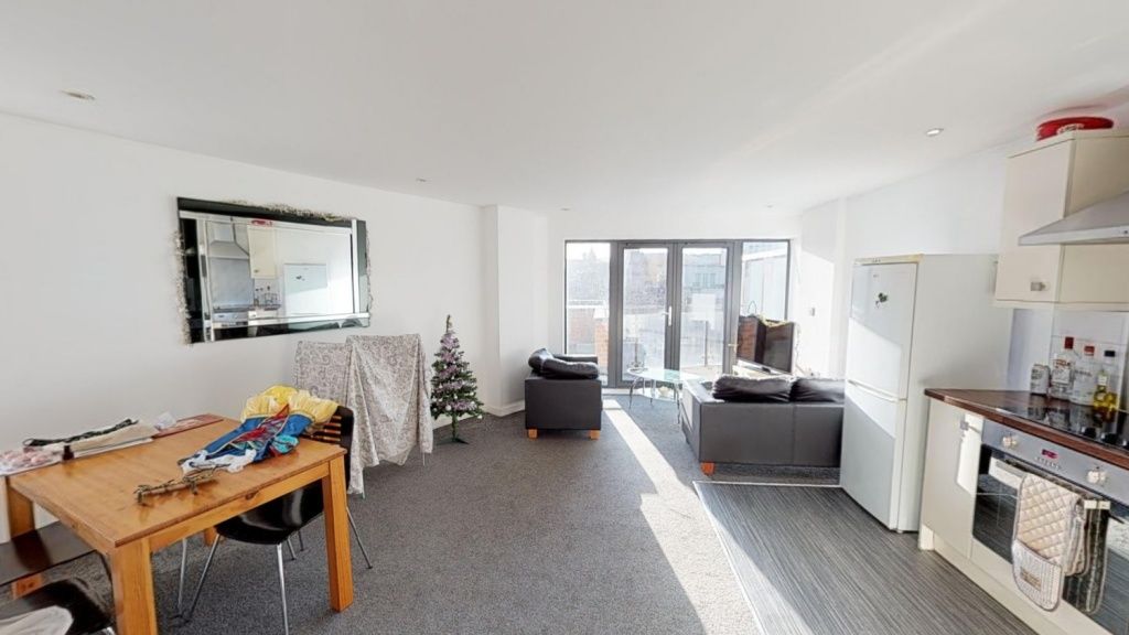 Property photo 2 of 5 Bright And Inviting Living Room With Ample Natural...