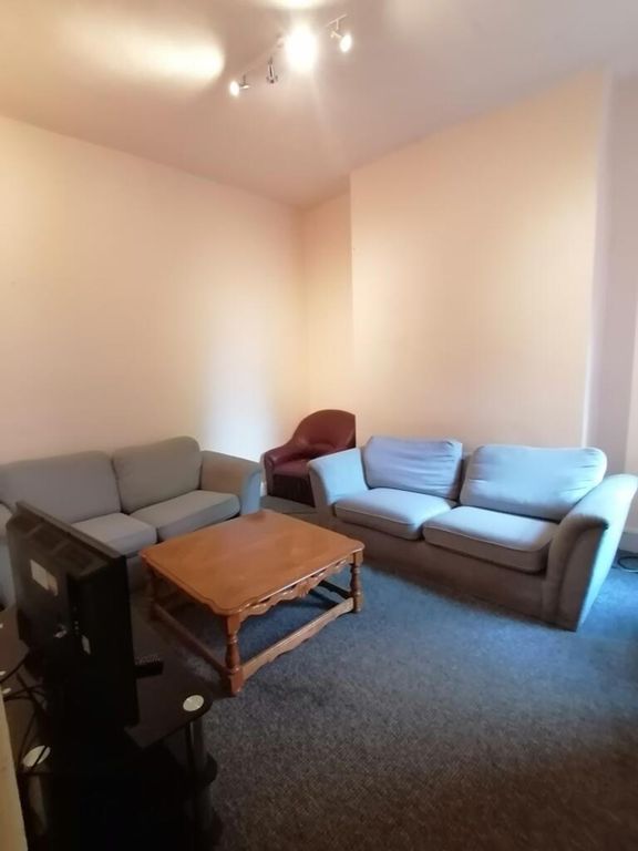 Property photo 1 of 9 A Cozy Living Room Featuring Comfortable Sofas And...