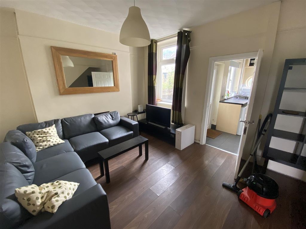 Property photo 1 of 12 Charming Lounge With Large Sofa And Wood Floors...