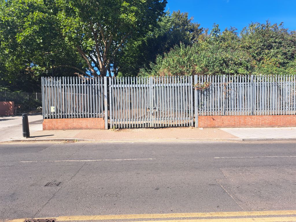 Property photo 1 of 3 A Large Plot Of Land, With Metal Fencing Around It.