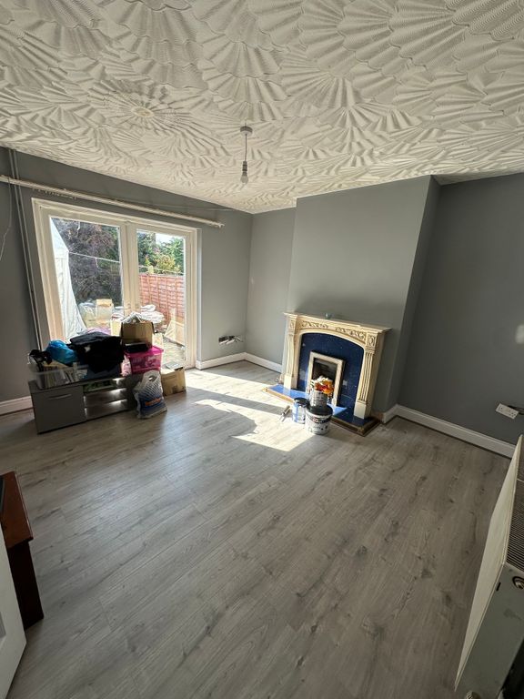 Property photo 3 of 9 A Bright And Airy Living Room Featuring Light Wood...