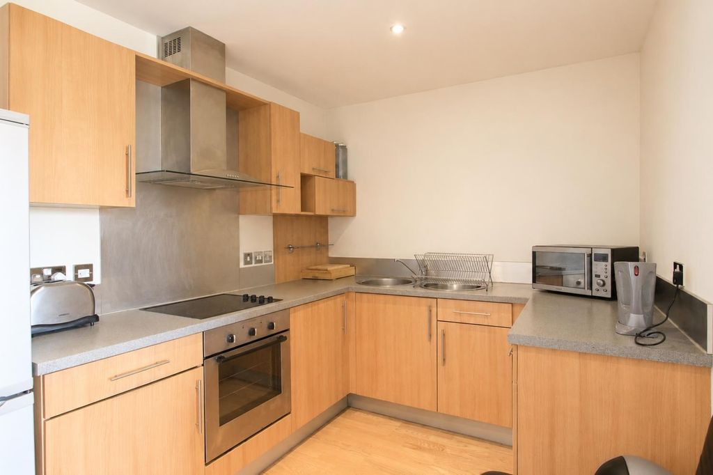 Property photo 2 of 7 Modern Kitchen With Ample Counter Space...