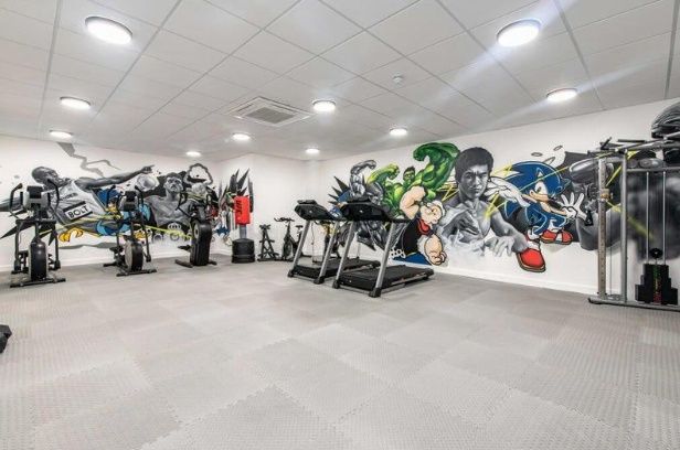 Property photo 2 of 6 Modern Gym Room Featuring A Variety Of Exercise Eq...