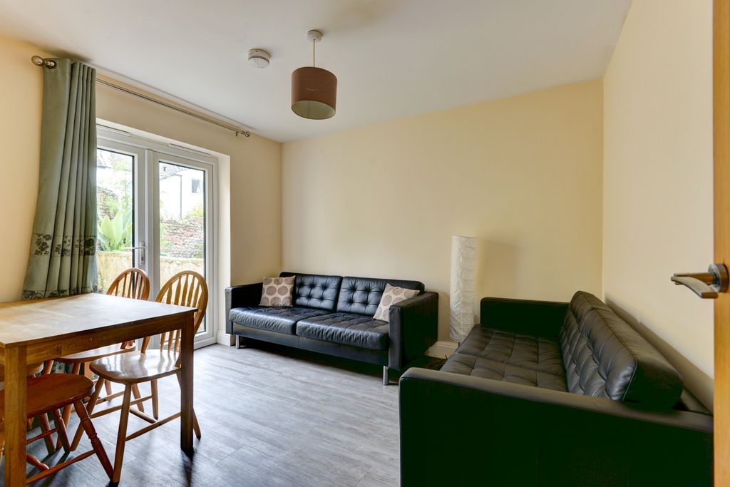 Property photo 1 of 14 Bright And Inviting Living Room With Large Window ...