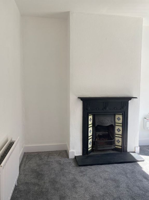 Property photo 3 of 11 Lounge Fireplace