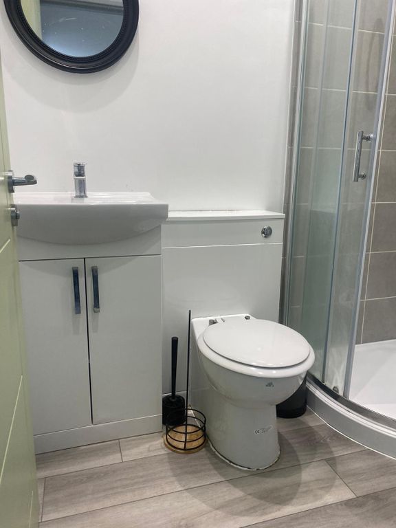 Property photo 2 of 5 Modern And Clean Bathroom With A White Vanity, Toi...