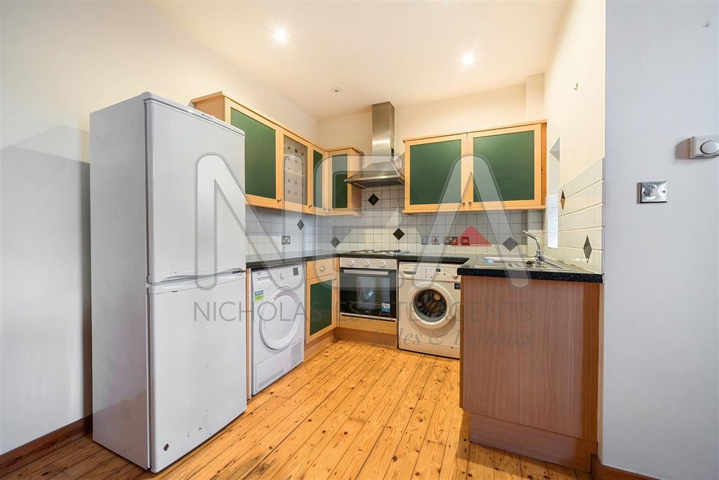 Property photo 3 of 13 Kitchen Area