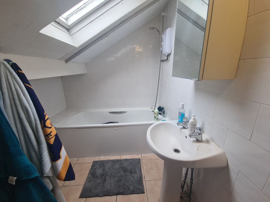 Property photo 3 of 4 A Clean, Well-Maintained Bathroom Featuring A Bath...