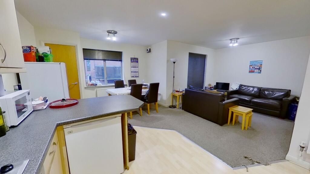 Property photo 1 of 6 Bright And Inviting Living Room Featuring A Cozy S...