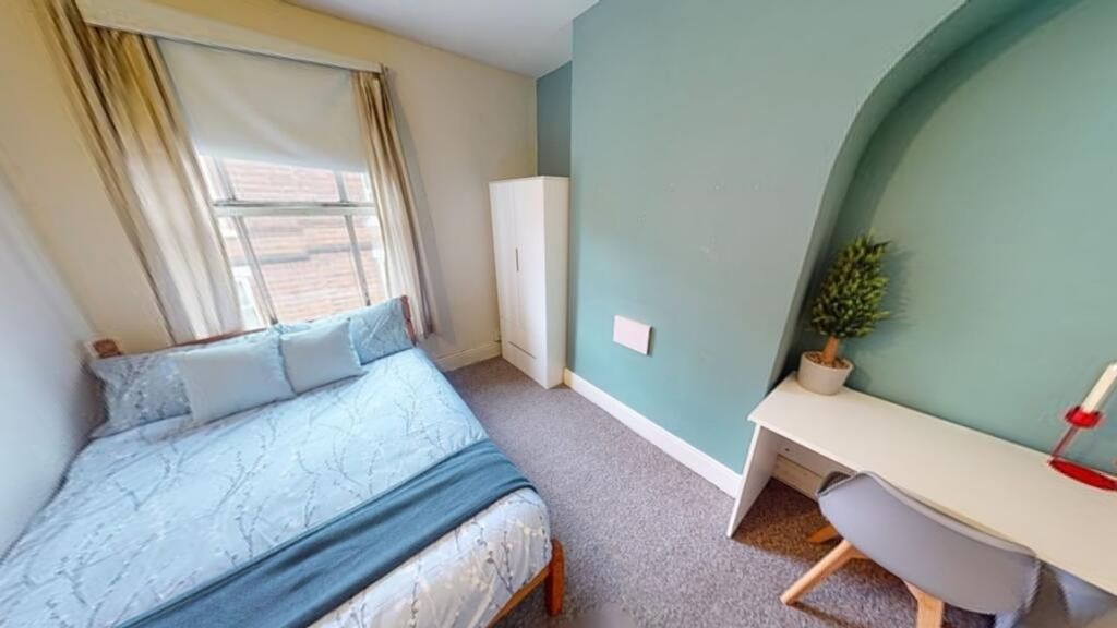 Property photo 3 of 8 This Charming Double Bedroom Features A Cozy Bed, ...