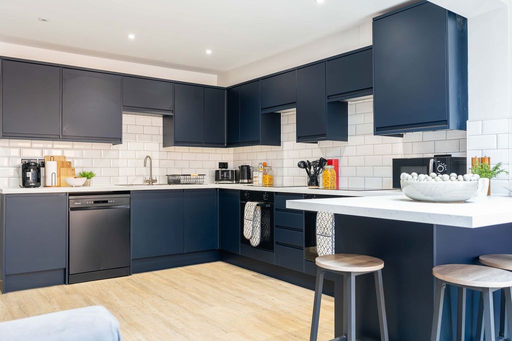 Property photo 2 of 46 Modern Kitchen With Sleek Navy Blue Cabinets, Whit...