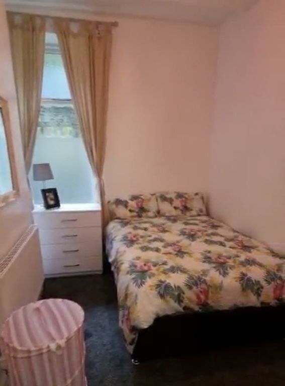 Property photo 2 of 7 Cozy Double Bedroom Featuring A Colorful Floral Be...