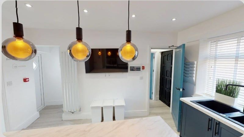 Property photo 2 of 9 Bright And Modern Kitchen Featuring Large Windows ...