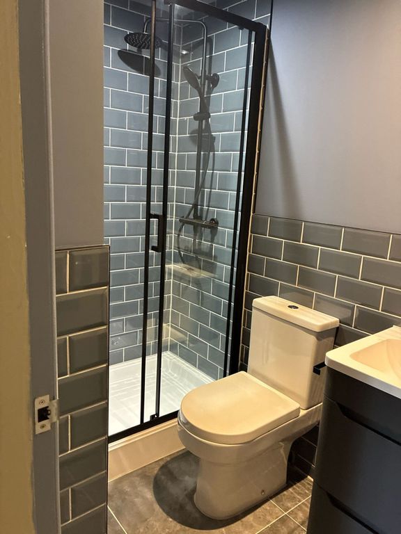 Property photo 3 of 3 Stylish Modern Bathroom With Rainfall Shower...
