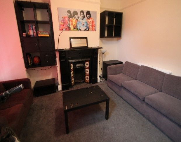 Property photo 3 of 7 A Cozy Living Room Featuring A Comfortable Sofa An...