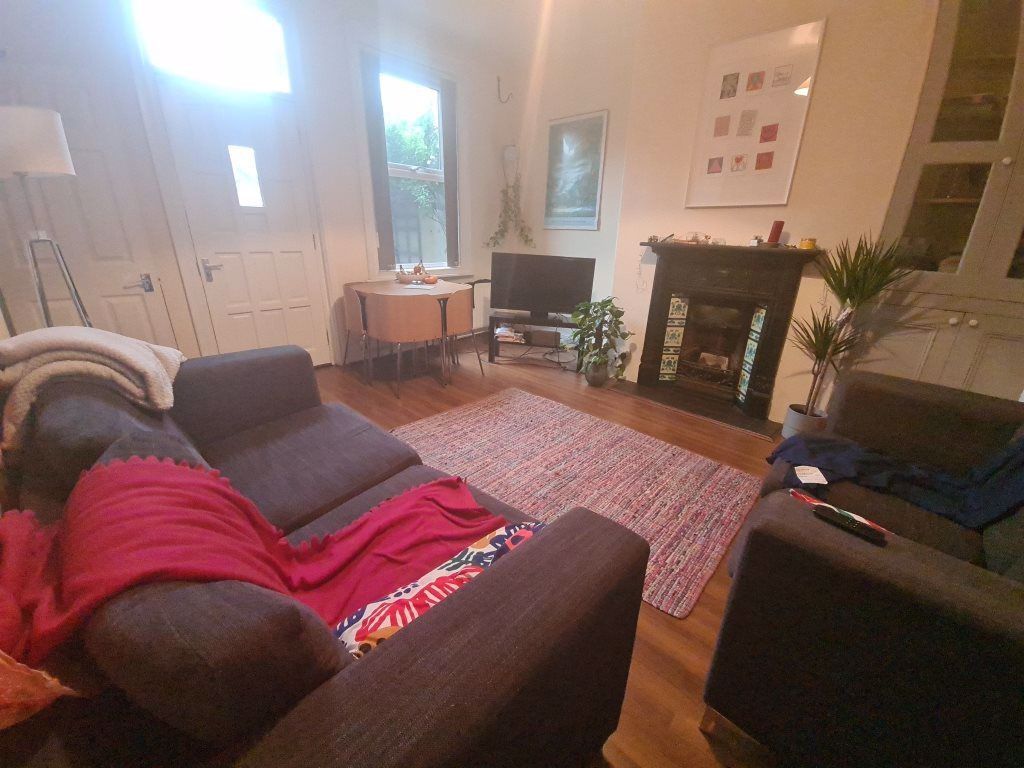 Property photo 1 of 21 A Cozy And Well-Maintained Living Room Featuring c...