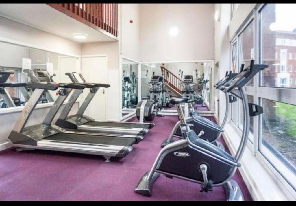 Property photo 3 of 7 Bright And Well-Maintained Gym Area With Modern Ex...