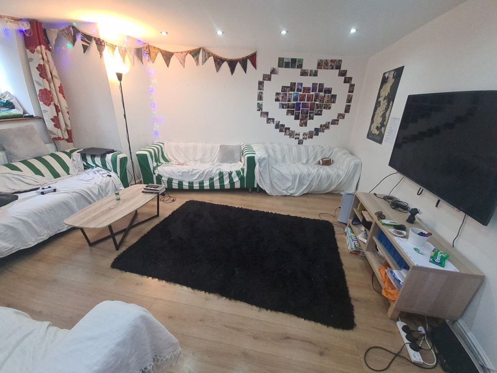 Property photo 3 of 24 A Cozy And Inviting Living Room Featuring Multiple...