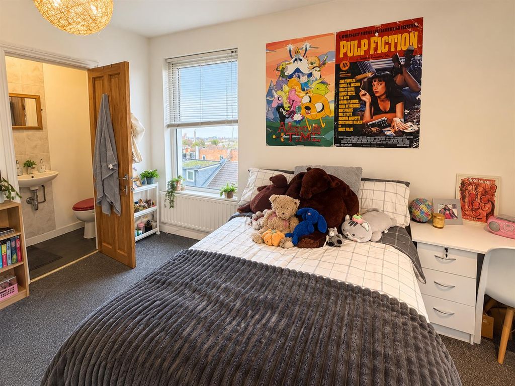 Property photo 2 of 11 Cozy Bedroom With Plush Toys And Posters.Png