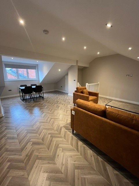 Property photo 3 of 10 Bright And Spacious Living Room Featuring Modern F...