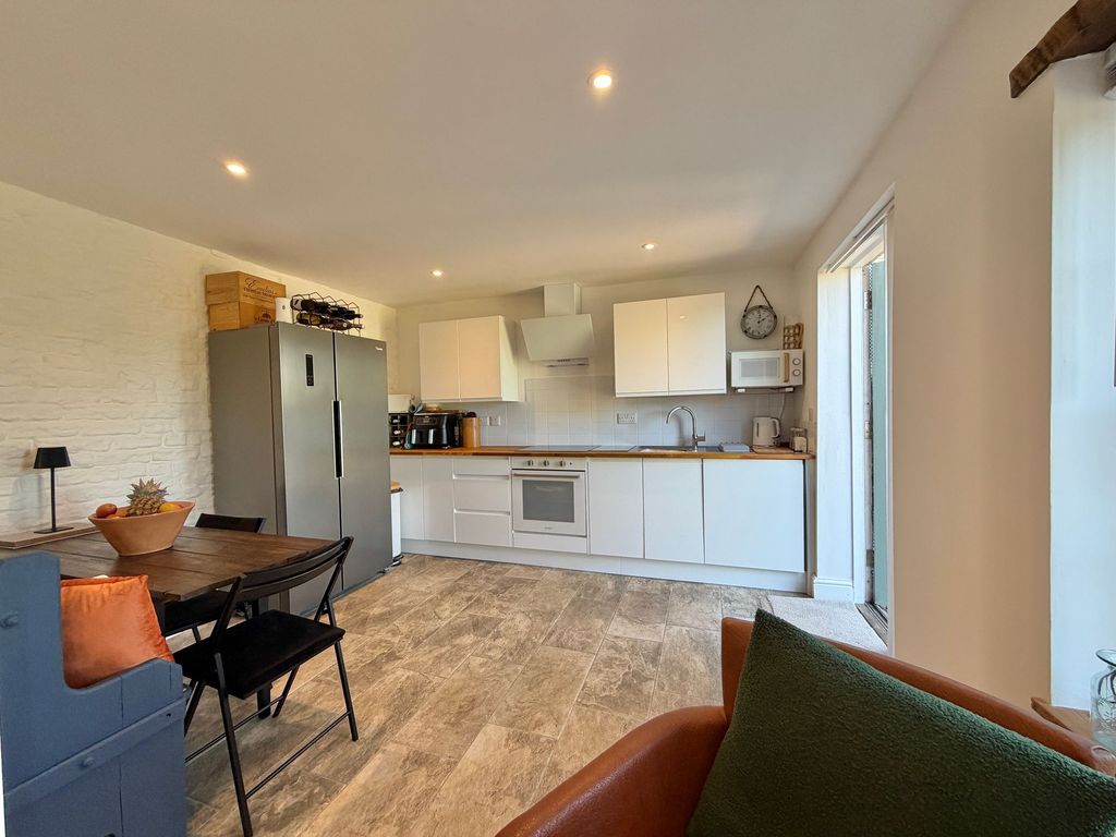 Property photo 3 of 16 Dining Kitchen