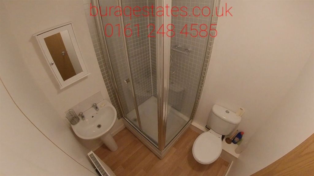 Property photo 3 of 4 Clean Compact Bathroom With A Corner Shower Cubicl...