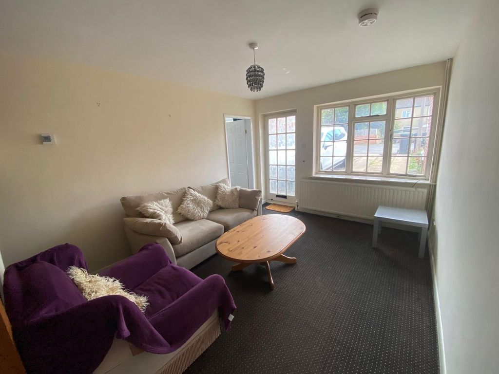 Property photo 3 of 12 A Cozy Living Room Featuring Comfortable Seating A...