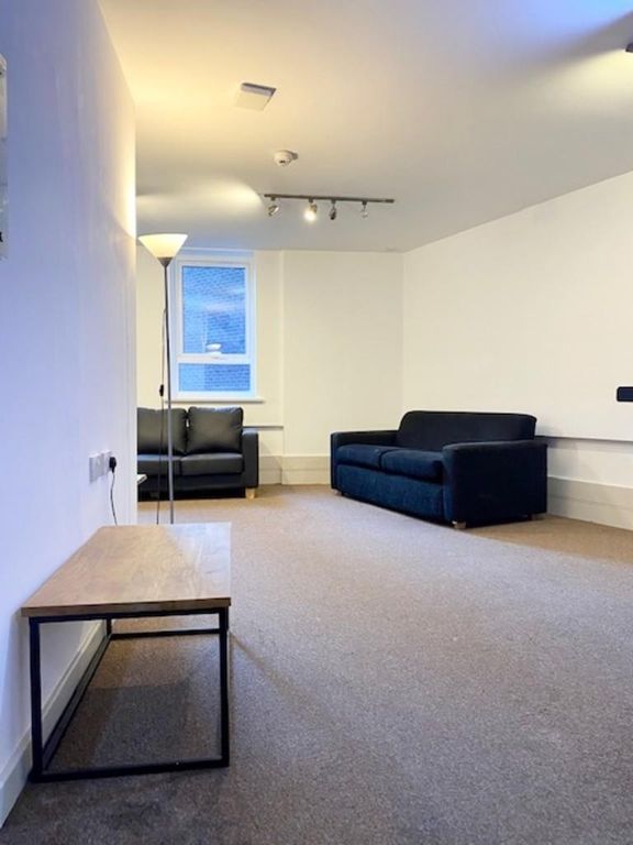 Property photo 2 of 9 A Neat And Inviting Living Room Featuring Contempo...